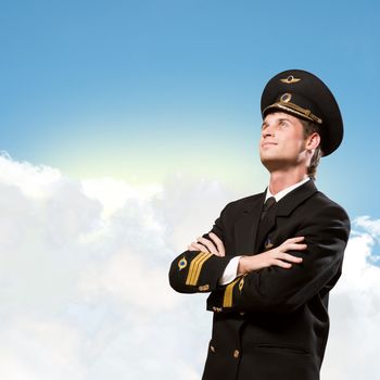 pilot is in the form of arms folded, against the sky with clouds