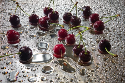 Wet sweet cherry with water droplets.