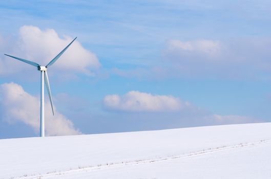 windturbine surrounded by snow