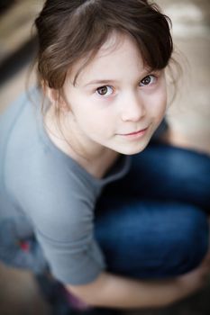 Young girl looking up and smiling