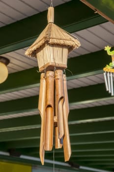 Hanging objects consisting of a house with a few pieces of cane