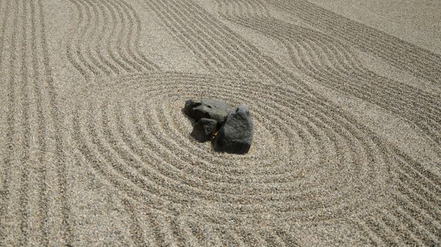 Rocks on the sand in the Japanese Zen Garden for meditation