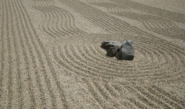 Rocks on the sand in the Japanese Zen Garden for meditation