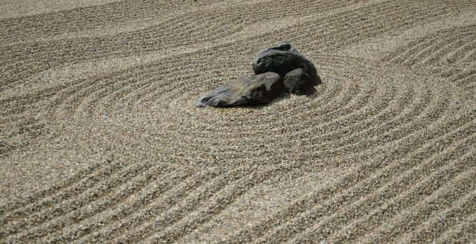 Rocks on the sand in the Japanese Zen Garden for meditation