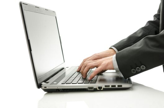 Closeup of business man working on office laptop.