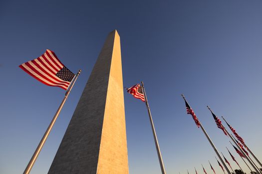 Washington Monument at Sunset with US flag