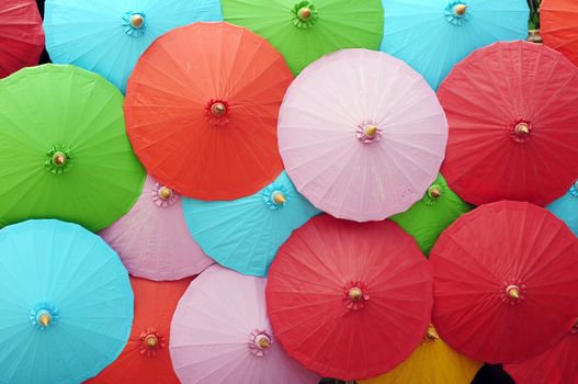 Colorful umbrellas in a pile