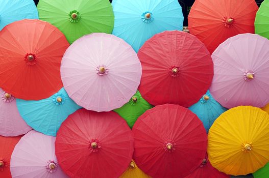 Colorful umbrellas in a pile