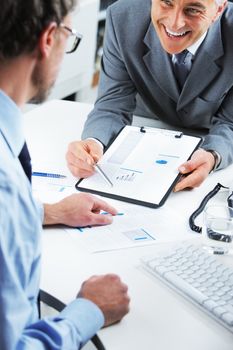 Business colleagues discussing together in an office