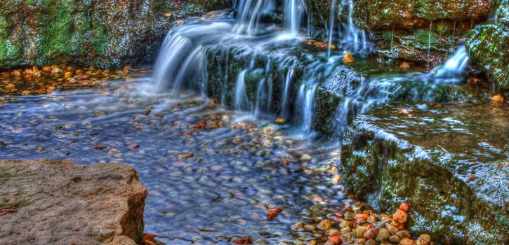 Long exposure of a beautiful cascading waterfall in the spring time in High Dynamic Range.
