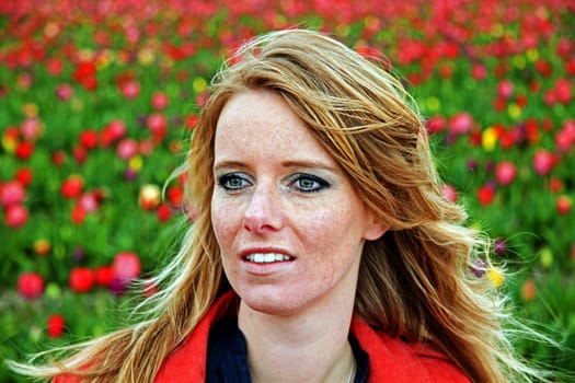 Young woman in the tulip fields