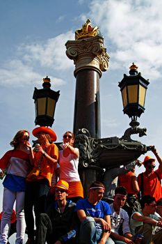 AMSTERDAM, NETHERLANDS - APRIL 30: People in orange celebrating in Amsterdam during the coronation of the new king Willem Alexander from the Netherlands on 30 april 2013