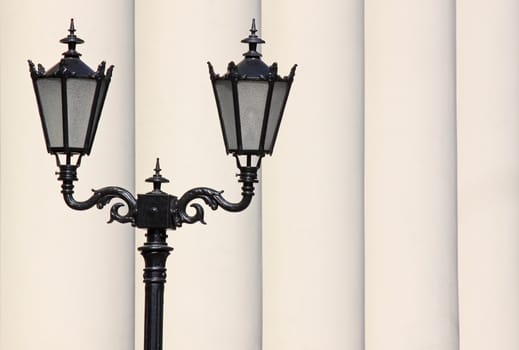 street lantern in front of row of pillars