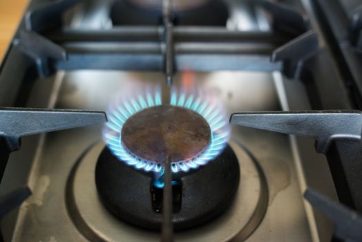 Gas oven in kitchen - closeup with burning flames