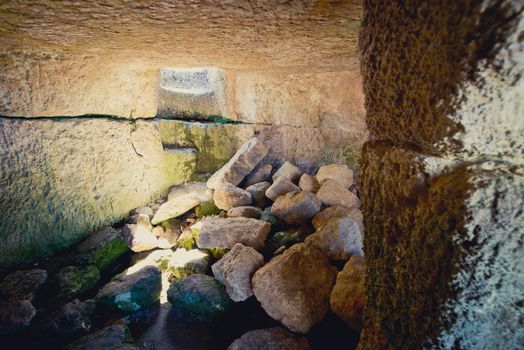 interior of the cave with rocks and window