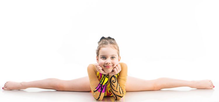 little girl gymnast on the splits on a white background