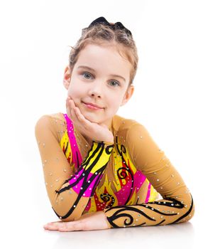 beautiful little girl gymnast on a white background