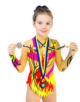 little girl gymnast with a medal over white background