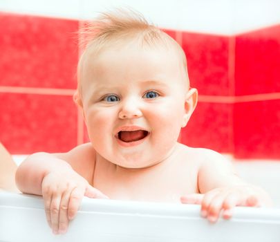 cute smiling baby girl in bath