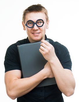 amusing man with fake glasses and book isolated on a white background