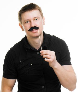 Young man with fake mustache. picture over light background isolated on a white background