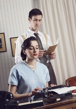 Business partners working in an office, vintage style