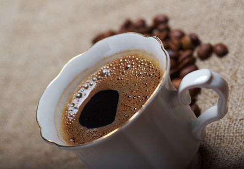 Coffee cup coffee beans background
