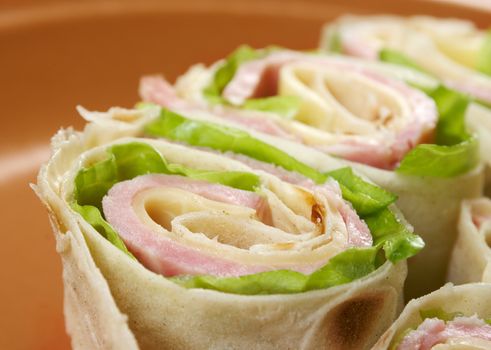 healthy club sandwich pita bread roll with cheese,ham,parsley