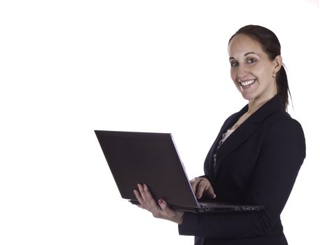 Smiling business woman working on a laptop computer