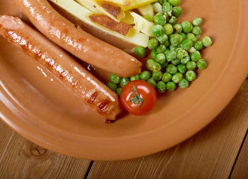 Sausages with french fries and vegetables