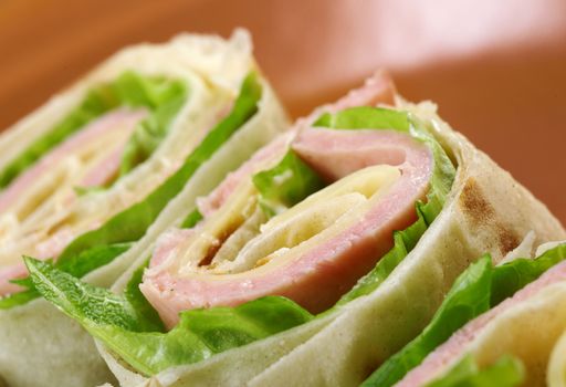 healthy club sandwich pita bread roll with cheese,ham,parsley