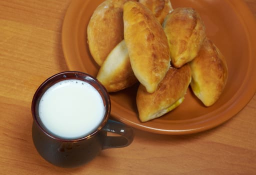 russia traditions pierogi .Home cake with cabbage against the wooden table