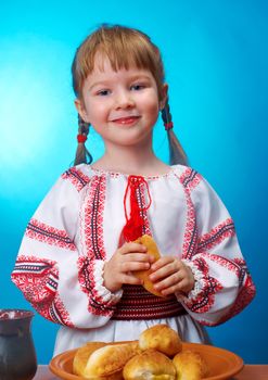 Russian little girl eats homemade pie