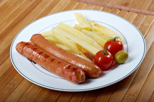 Sausages with french fries and vegetables