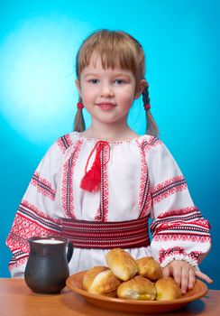 Russian little girl eats homemade pie