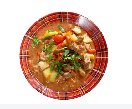 Traditional Hungarian homemade hot goulash soup.isolated on white background. 