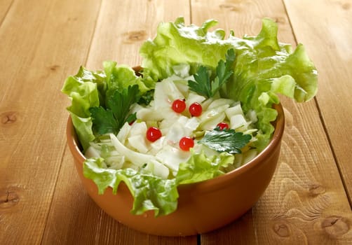 Spring  fresh 	farm-style vegetables salad of cabbage
