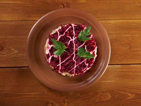 traditional russian salad with salted herring and beet -Selyodka Pod Shuboy (Dressed Herring)
