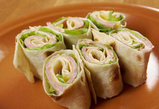 healthy club sandwich pita bread roll with cheese,ham,parsley