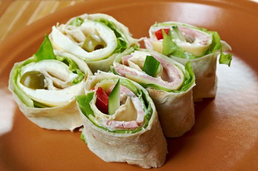 healthy club sandwich pita bread roll with cheese,ham,parsley