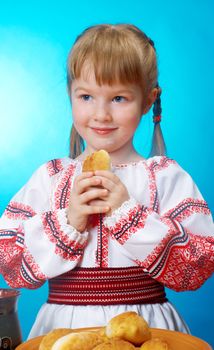 Russian little girl eats homemade pie