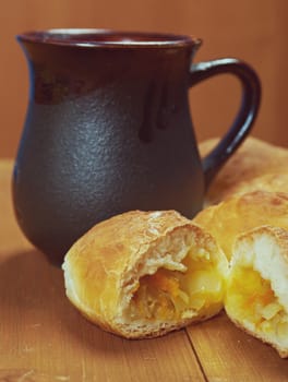 russia traditions pierogi .Home cake with cabbage against the wooden table