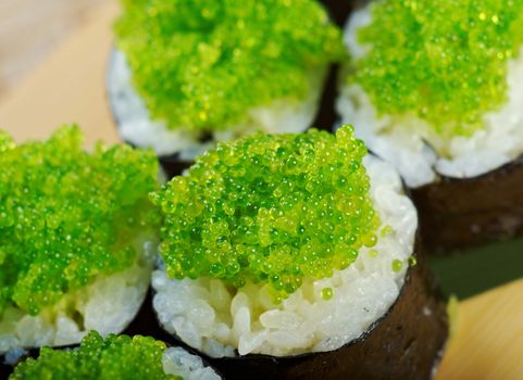 Tobiko (flying fish roe) Gunkan Maki Sushi.Roll made of Smoked fish