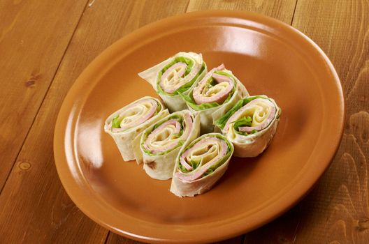 healthy club sandwich pita bread roll with cheese,ham,parsley