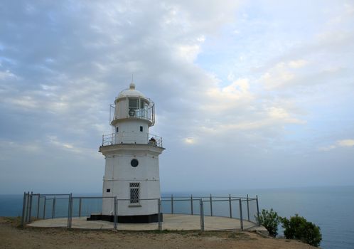 Lighthouse. The movement of clouds on the mountain Meganom, Crimea, Ukraine