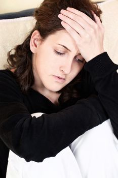 woman having headache at home