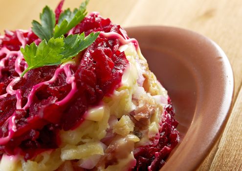 traditional russian salad with salted herring and beet -Selyodka Pod Shuboy (Dressed Herring)
