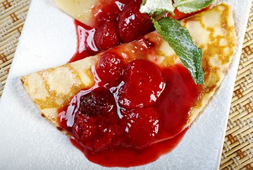 Pancakes with strawberry jam.closeup
