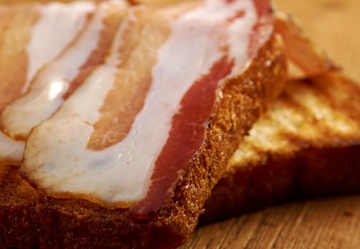 pile  toasted bread slices for bacon.Close up of toasted white bread in slices