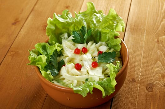 Spring  fresh 	farm-style vegetables salad of cabbage
